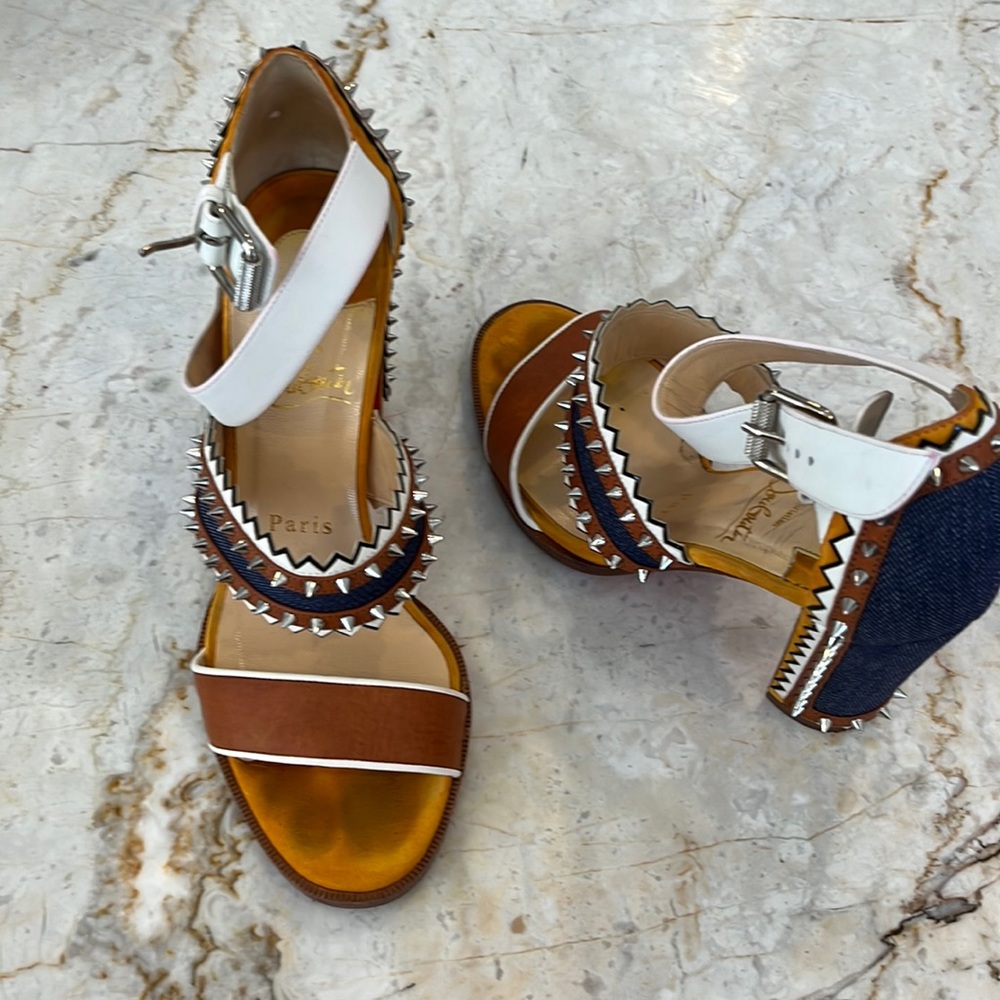 Size 37 Loubuittons some studs missing and photographed